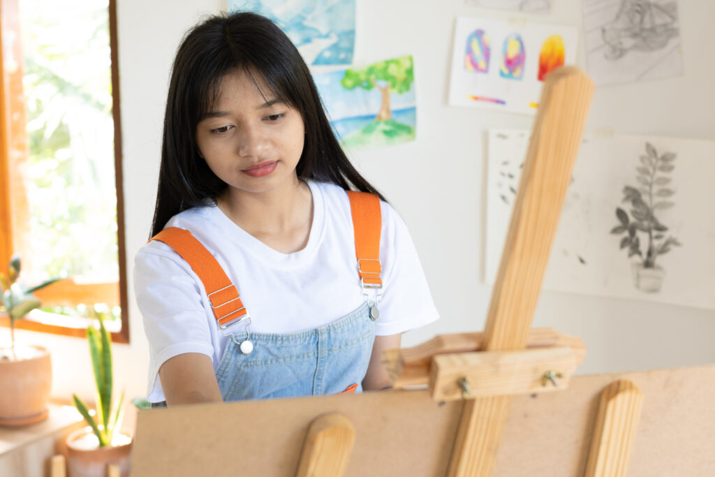 young schoolgirl painting